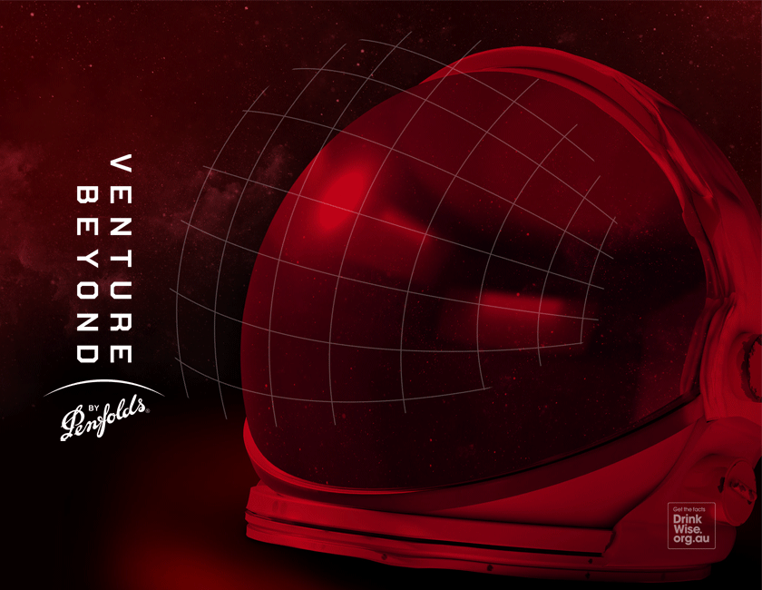 Astronaut's helmets against red galaxy background
