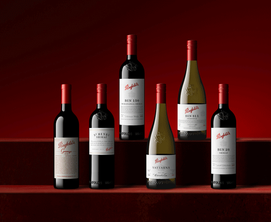 Six Penfolds bottles stand against a red background.